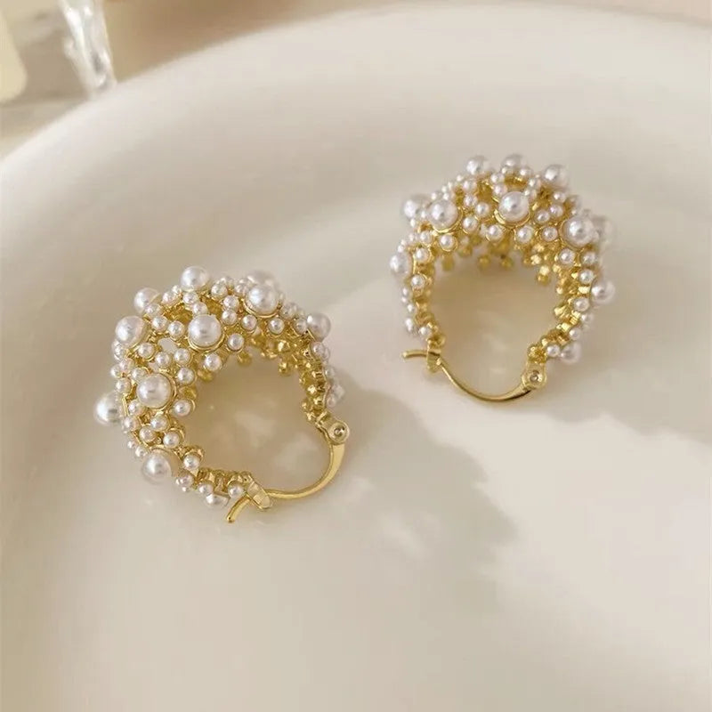 Gold women's flower basket earrings with pearl bead decoration on copper