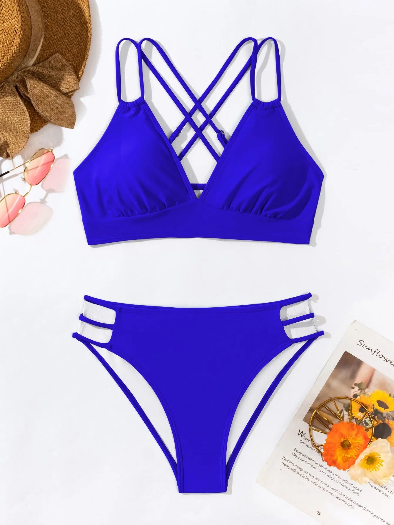 Women's black halter neck bikini swimsuit with V-neck top and split shorts on mannequin