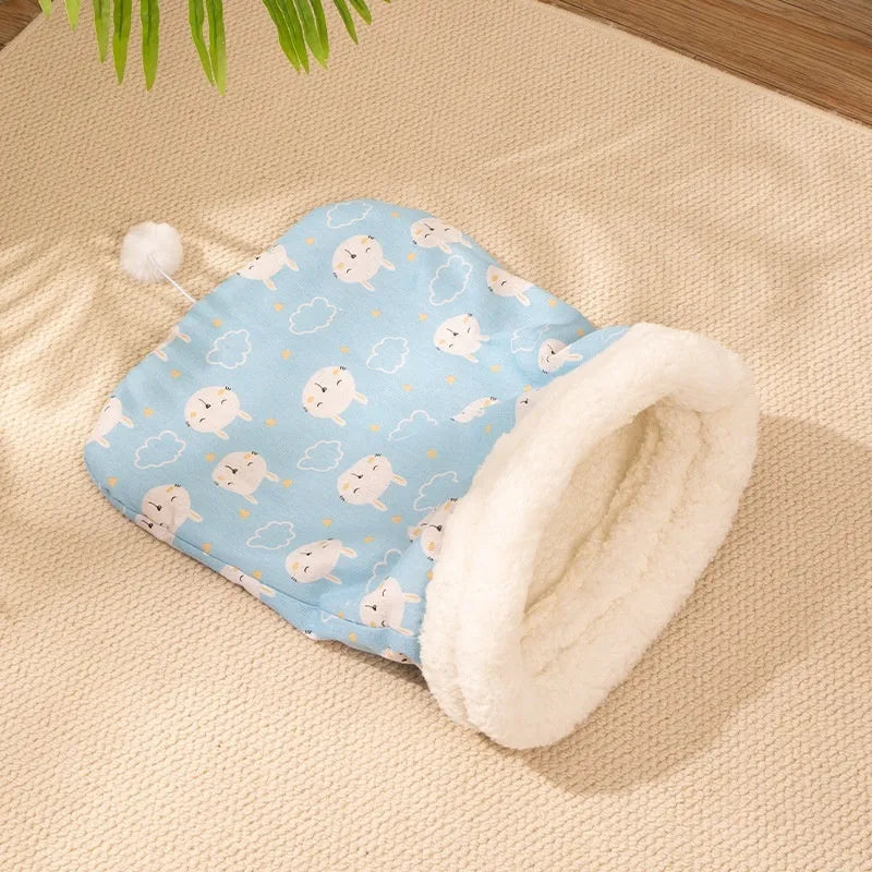 Blue rabbit design and pink trojan design cat sleeping bag nests, each measuring 50cm by 40cm