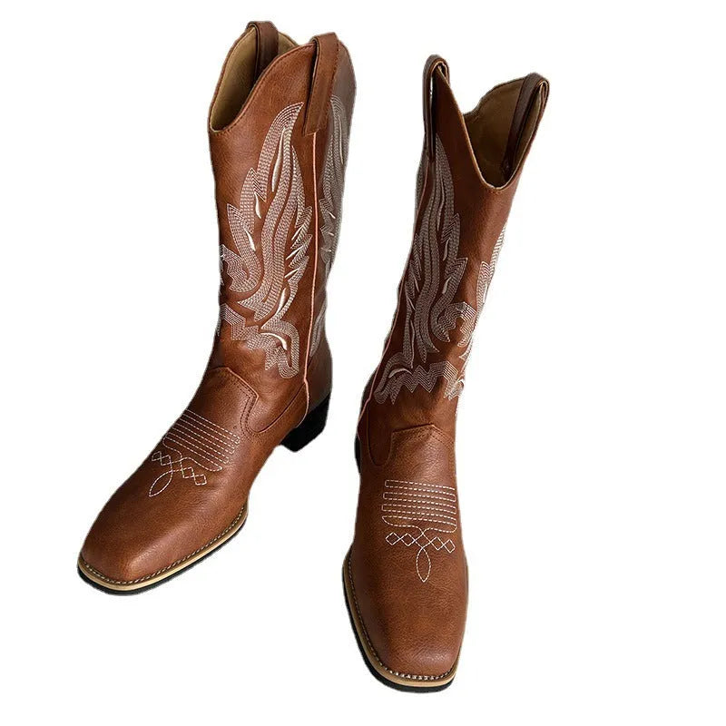 Brown women's mid-calf boots with embroidery detail, round toe, and low square heel.