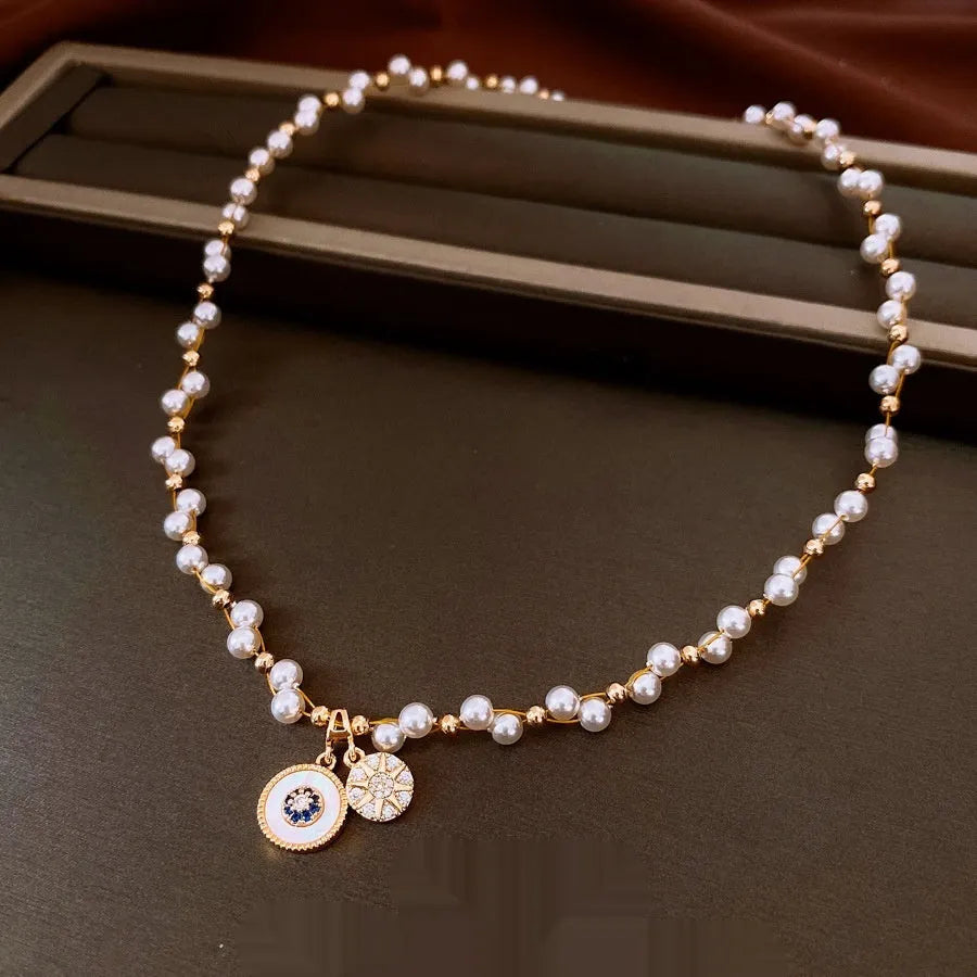 Gold electroplated zircon and imitation pearl pendant necklace with adjustable clavicle chain
