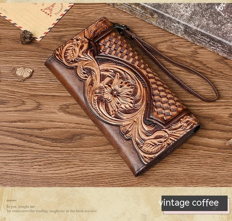 Retro brown floral embossed tri-fold leather wallet open to show interior compartments.