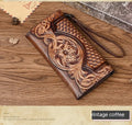 Retro brown floral embossed tri-fold leather wallet open to show interior compartments.