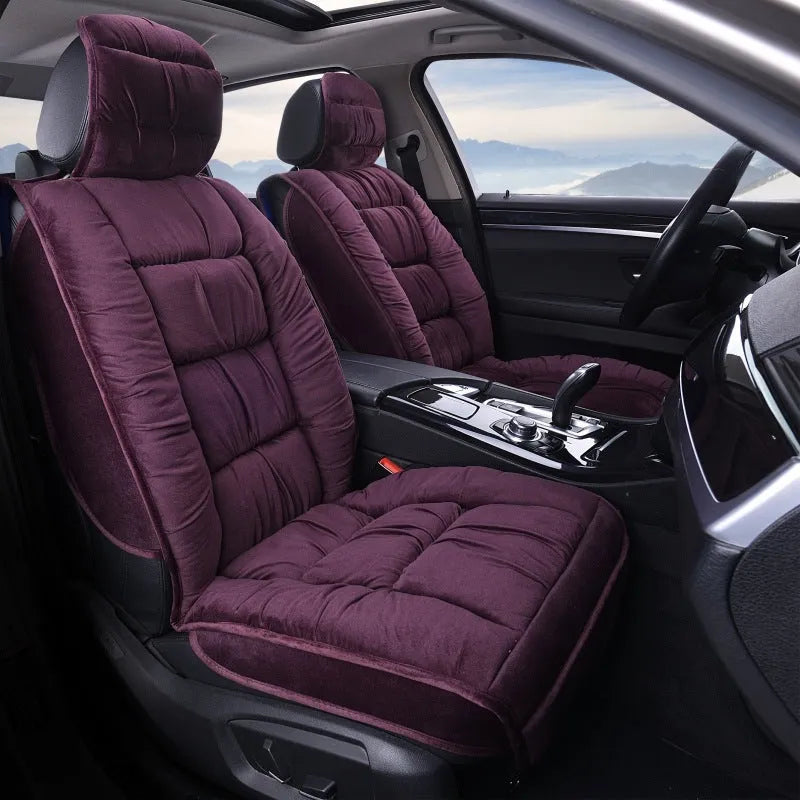 Short plush car seat cushion in charcoal grey on vehicle seat