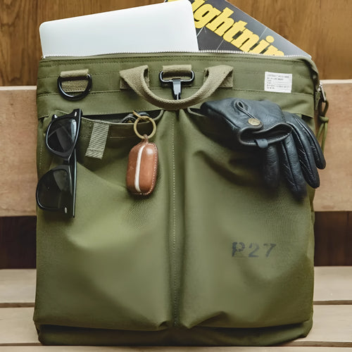 Canvas crossbody shoulder bag in military green with phone pocket and space for 15-inch laptop