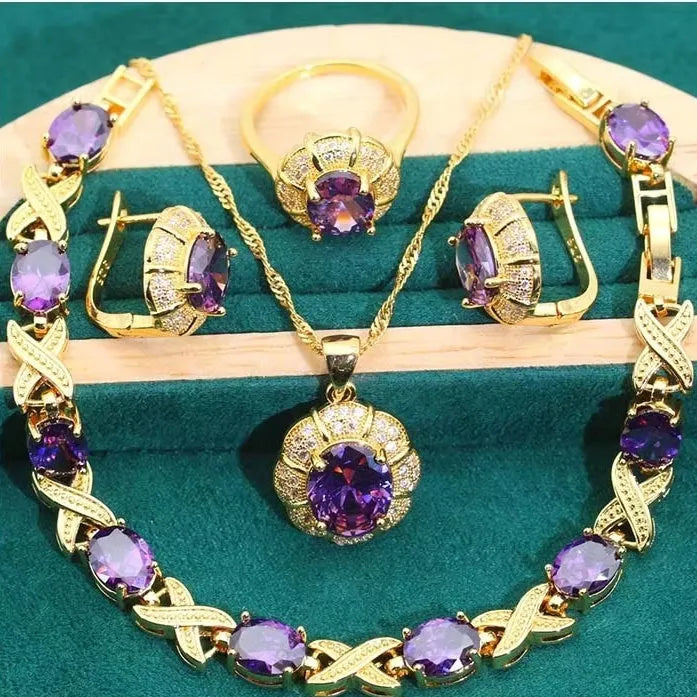 Gold plated cubic zirconia jewellery set showing necklace, earrings, ring, and bracelet with multi-colour stones