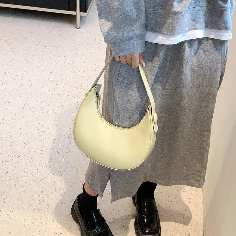 Women's retro shoulder bag in dumpling shape with sandwich pocket and zippered compartment