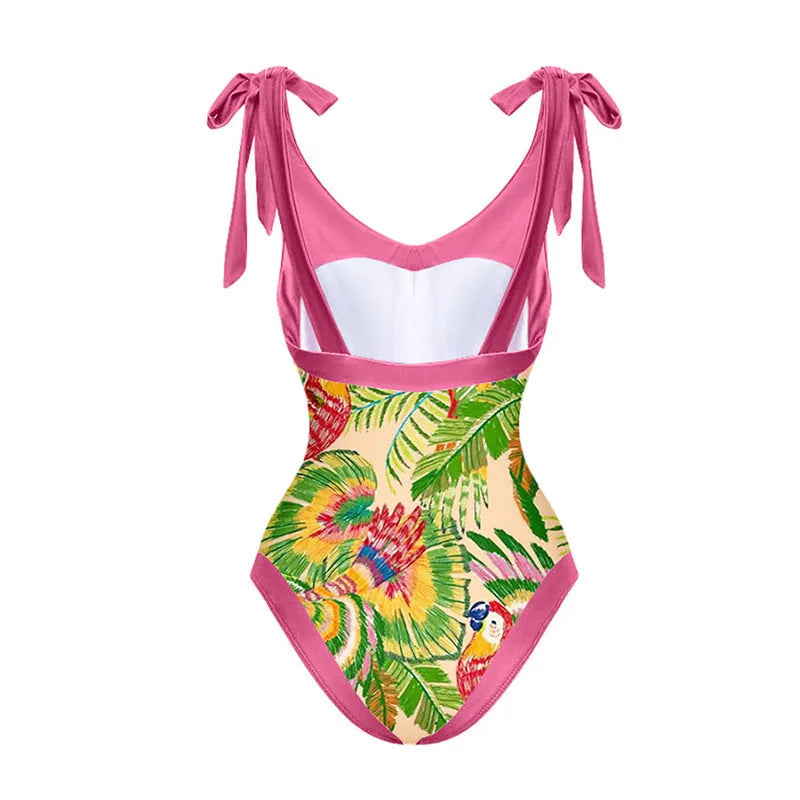 Women's pink floral print one-piece swimsuit with V-neck, covered belly, and attached skirt for swimming