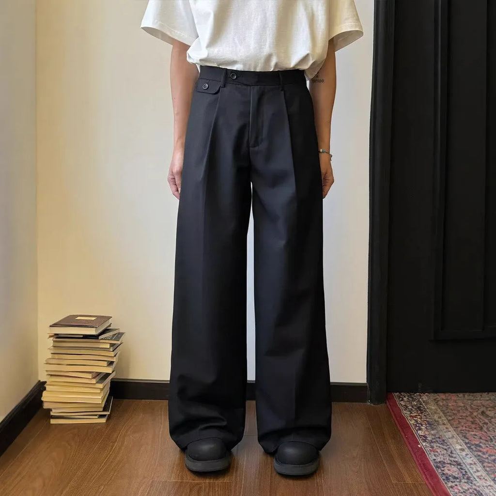 Men's straight-leg wide casual suit pants in brown solid colour, showing loose drape fit.