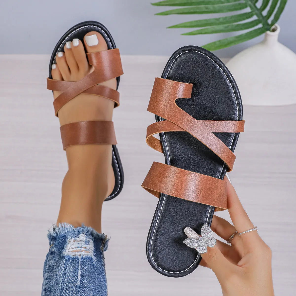 Pair of simple solid colour beach slippers with a one-line design and round toe.