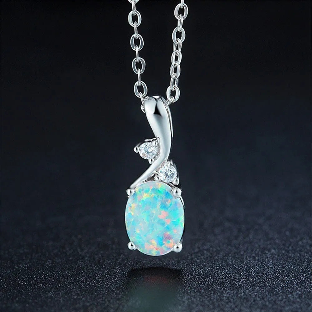 Water drop shaped opal pendant necklace with adjustable O-chain in rose gold or white electroplated finish.