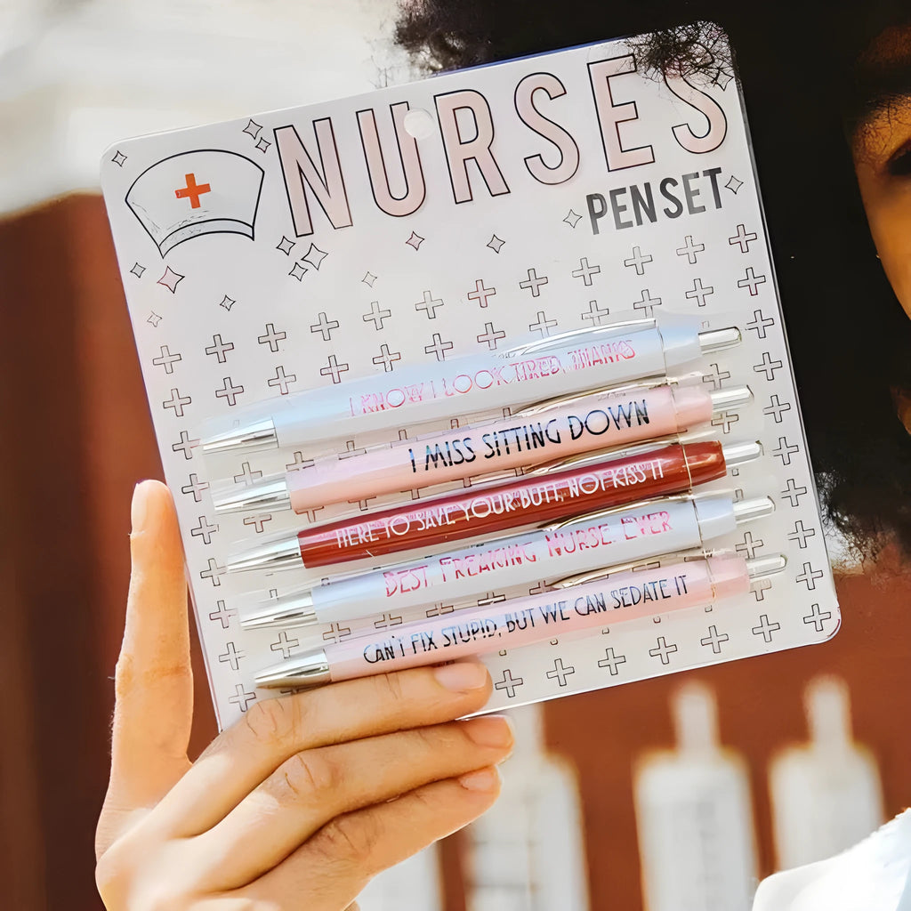 Five nurse-themed ballpoint pens with humorous medical copywriting on plastic barrels