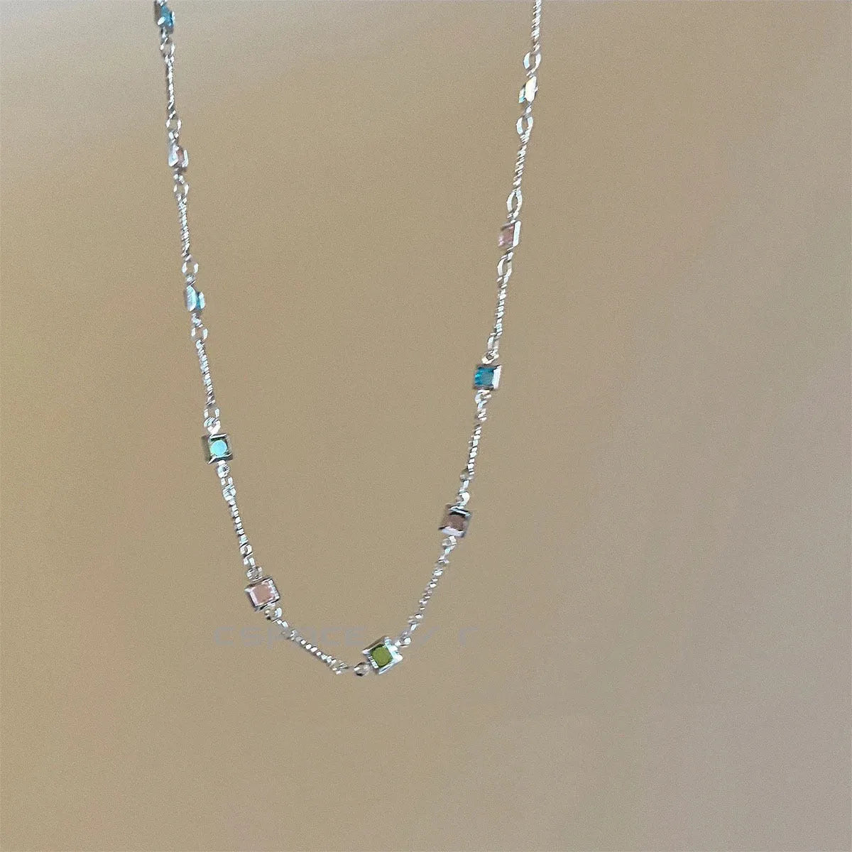 Square colour clavicle chain necklace with geometric quadrilateral links and artificial crystal detailing in gold finish