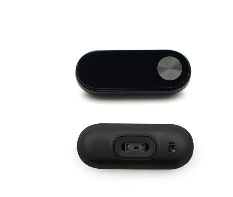 Black Xiaomi Mi Band 2 fitness tracker on wrist showing OLED display with heart rate data.