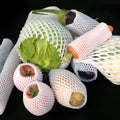 White foam shockproof protective net cover for fruit, shown in various sizes.