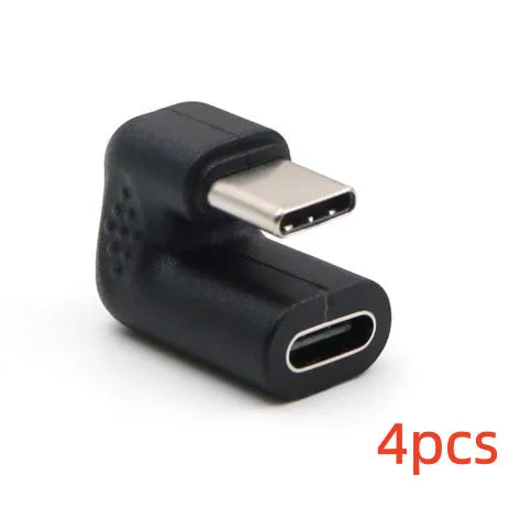 Set of four plastic USB male to female adapter extension cables with U-bend design on white background.