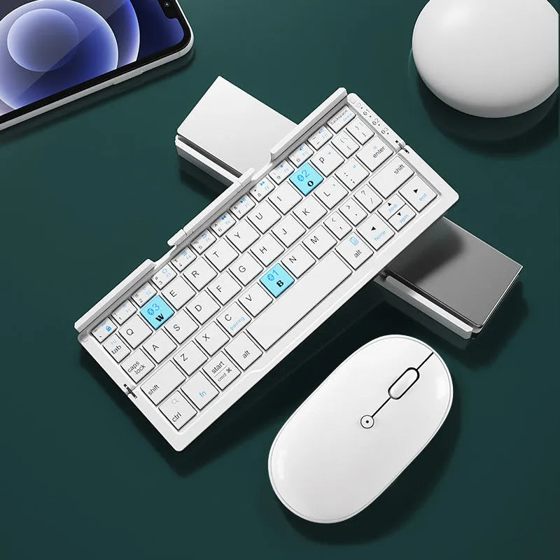 Silver aluminium folding Bluetooth keyboard open with smartphone propped on integrated stand