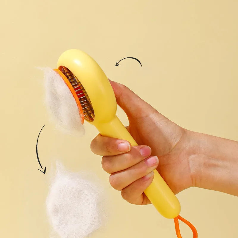 Small yellow duck-shaped pet grooming comb with open section design for cat and dog hair removal