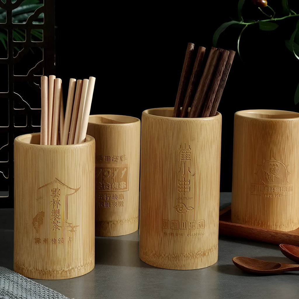 Wild bamboo chopsticks holder tube on a kitchen countertop.
