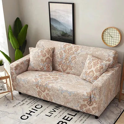 Geometric abstract printed stretch sofa slipcover covering a three-seater sofa with matching cushion covers.