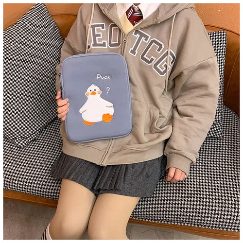 Blue cotton tablet case with embroidered cartoon duck design and a zipper.