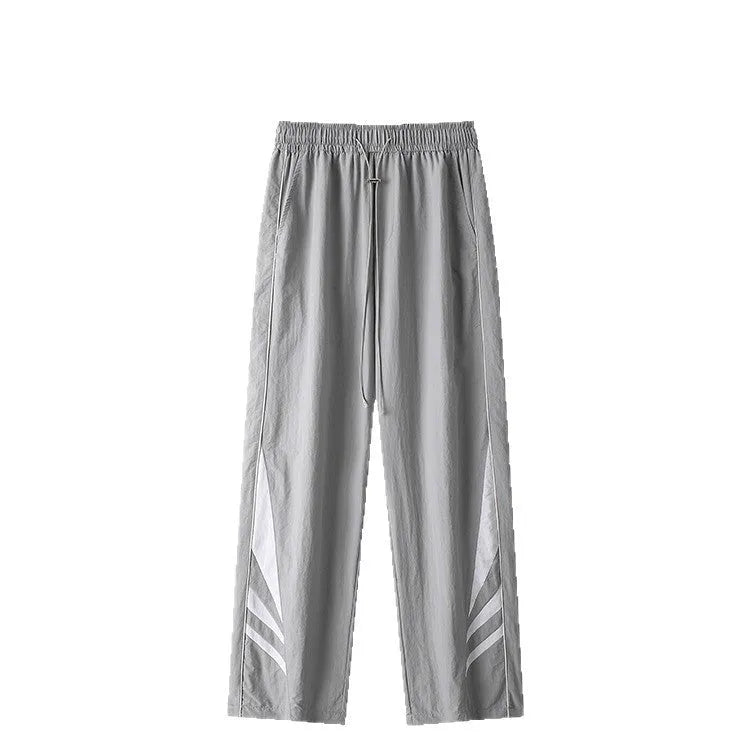 Black straight-leg loose-fit trousers on a plus-size male model for summer casual wear.