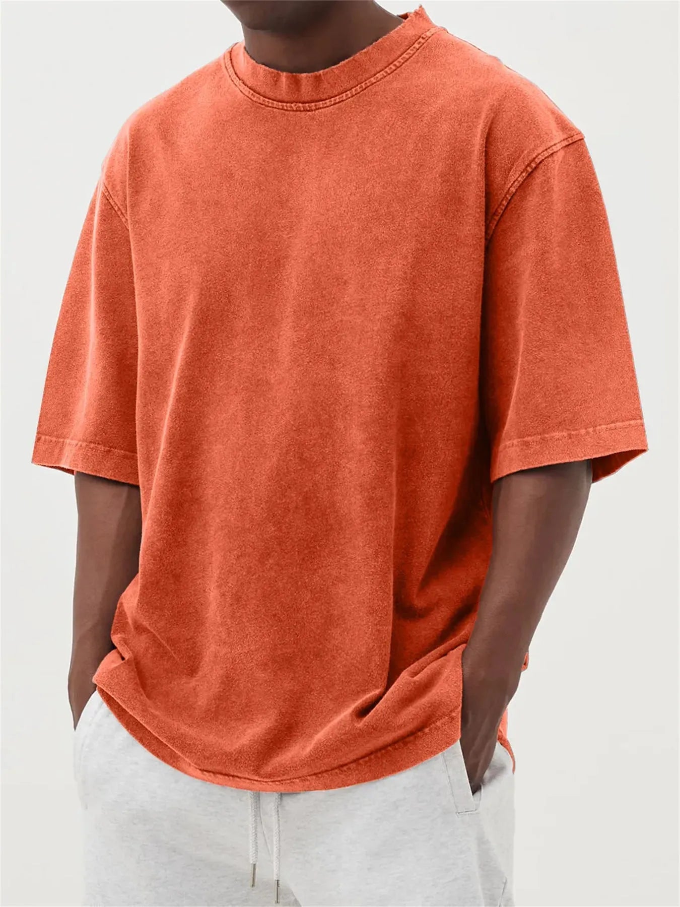 Men's distressed stone wash pullover T-shirt in loose fit with half sleeves available in multiple solid colours