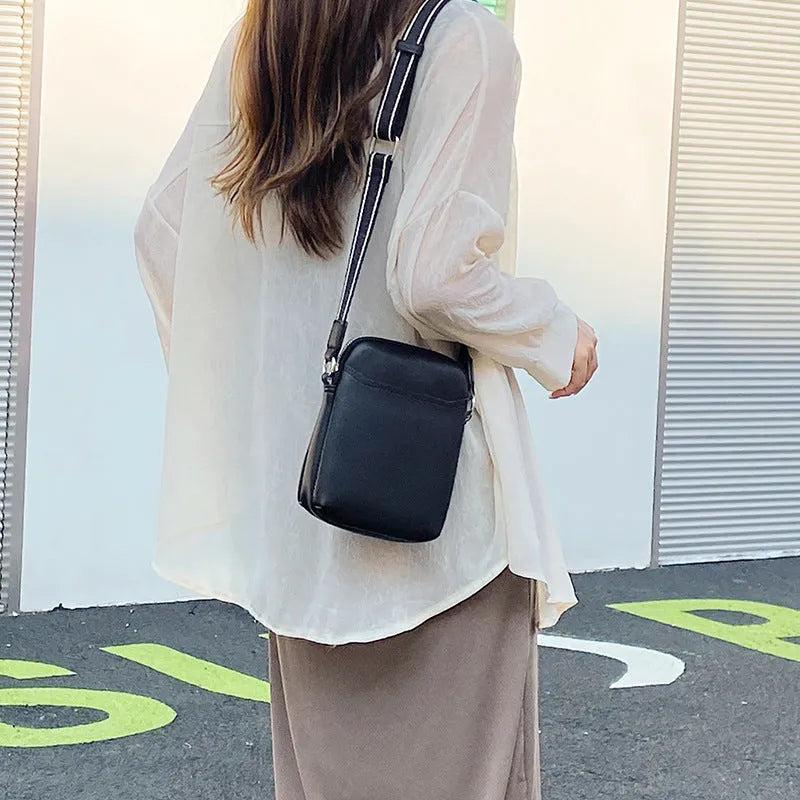 Solid colour PU leather crossbody phone bag for women shown in beige.