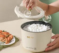 Miniature round rice cooker with mechanical controls and 2L capacity for 1-2 persons