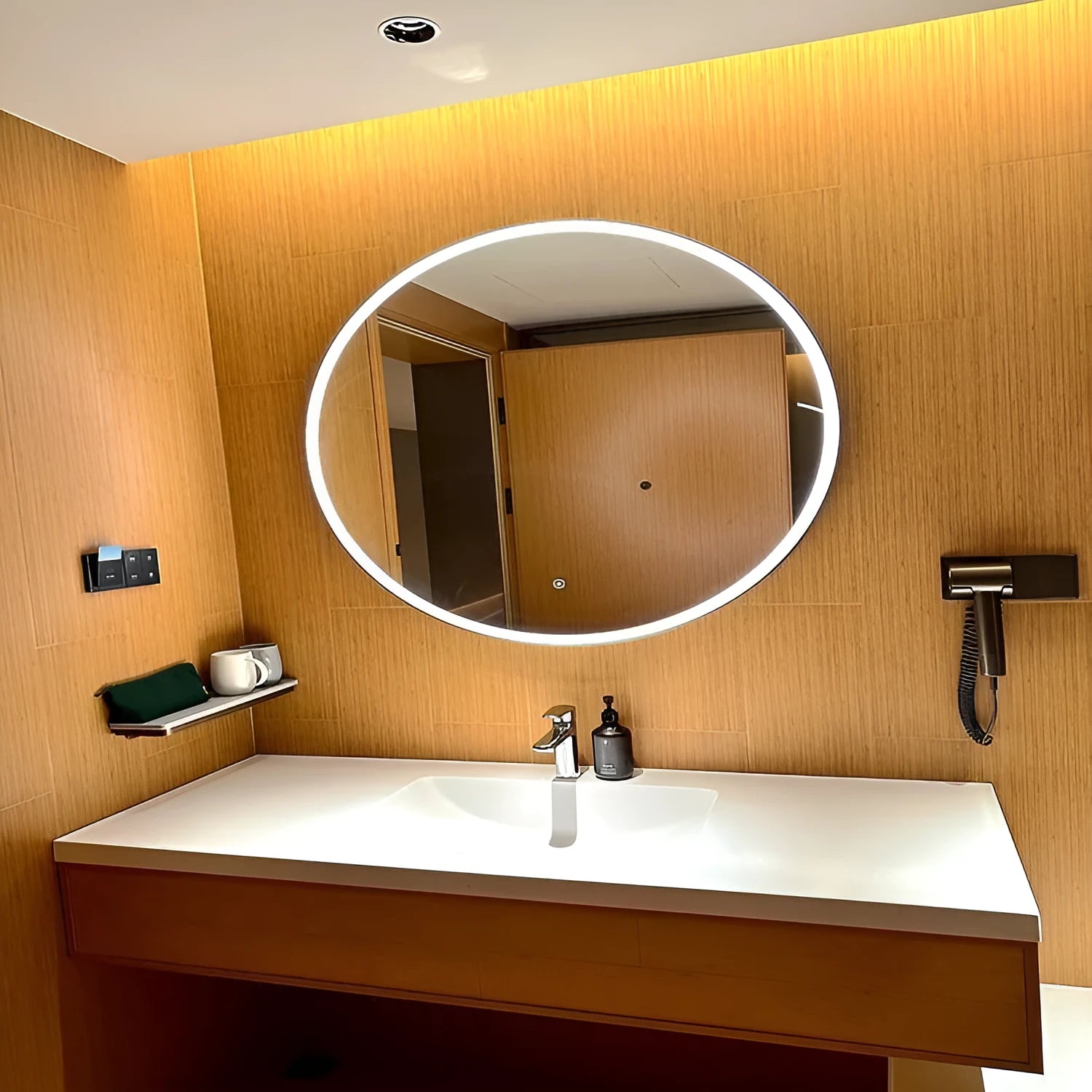 Round black aluminium frame smart LED bathroom mirror with touch dimming control on wall.