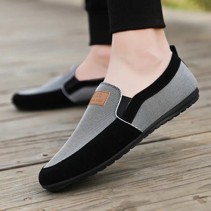 Men's grey and khaki canvas casual board shoes with round toe and stitching detail.