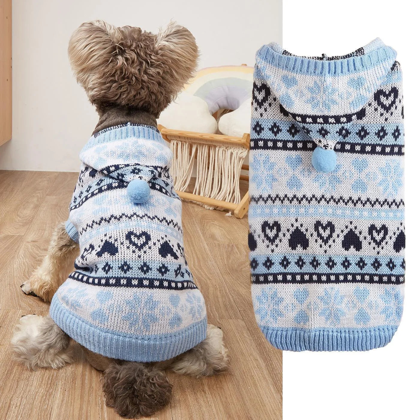 Pink striped dog sweater with snowflake and heart patterns on a small white Bichon