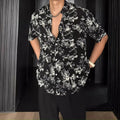 Loose casual short sleeve shirt with floral printed pattern and V-neck design in white colour