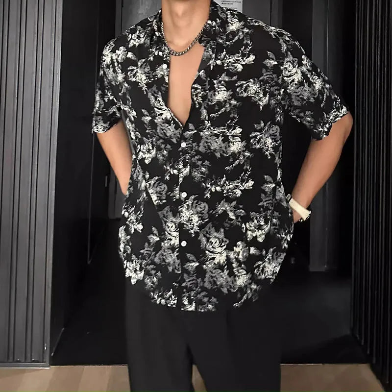 Loose casual short sleeve shirt with floral printed pattern and V-neck design in white colour
