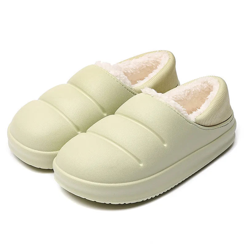 Women's green waterproof EVA winter slippers with plush lining and a non-slip sole.