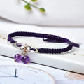 Women's natural strawberry quartz bracelet with a fruit-shaped crystal charm on wrist.