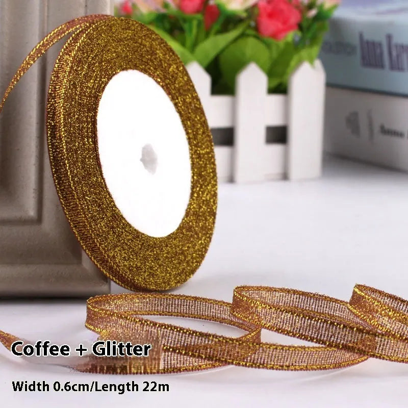 Roll of narrow 0.6cm wide polyester gift wrapping ribbon in assorted colours, showing 22 metre length.