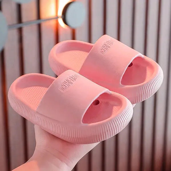 Children's mixed colour EVA slippers with non-slip soles showing size options from 15.5cm to 21.5cm