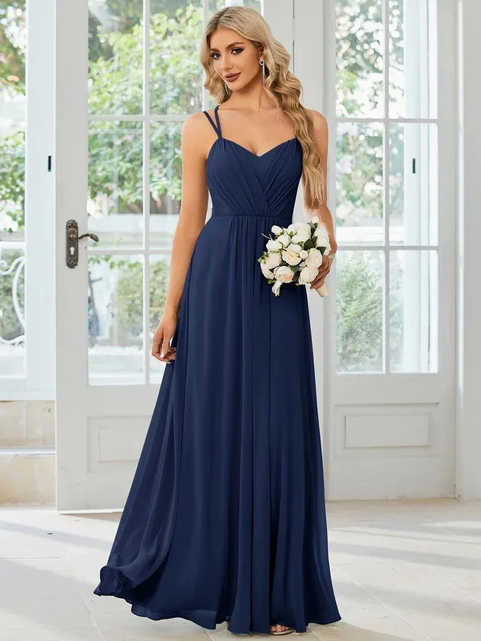 Women's long sleeveless A-line pleated dress in light green for banquet or casual wear.