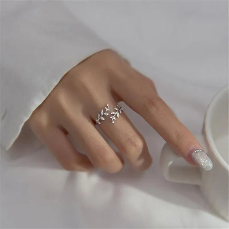 Geometric copper branch leaf ring for women in gold or silver electroplated finish.