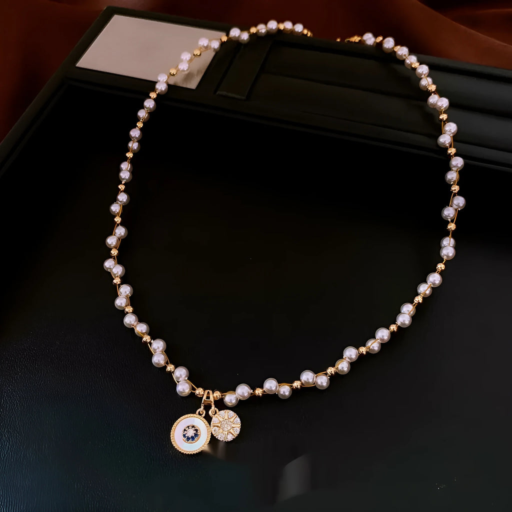Gold electroplated zircon and imitation pearl pendant necklace with adjustable clavicle chain