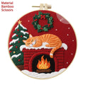 DIY embroidery material kit showing cotton linen fabric with cat and autumn fruit design, optional bamboo hoop and scissors