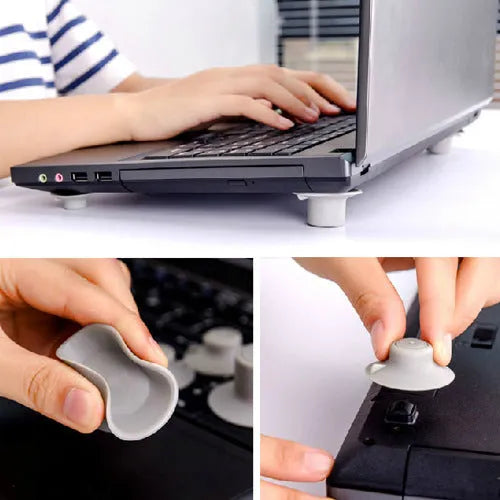 Set of four grey plastic laptop cooling pads: two large and two small, on a desk.