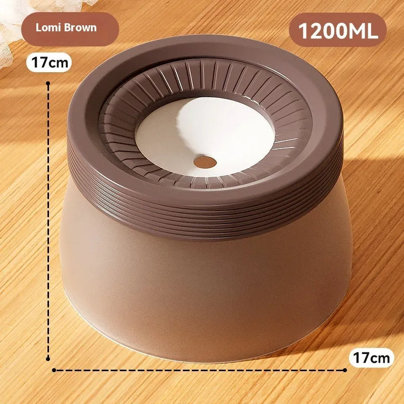 Blue suspended pet water bowl for dogs and cats on a white base plate, showing non-spill design.