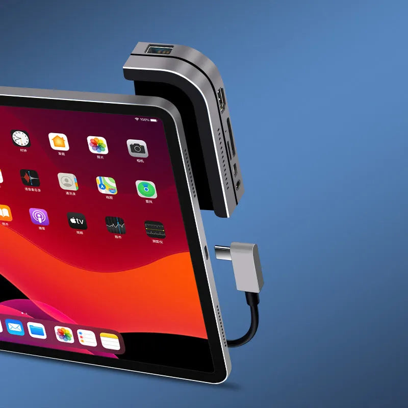 Silver aluminium grey 6-in-1 USB-C docking station for iPad Pro, showing HDMI and USB ports.