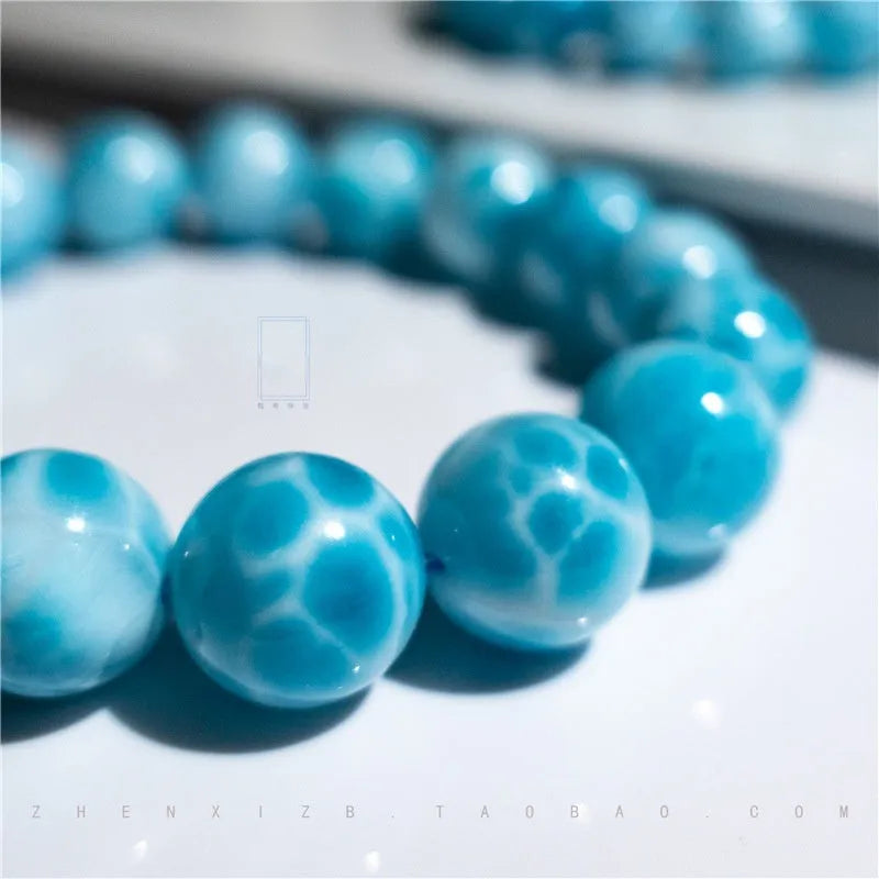 Blue natural crystal sea-pattern bodhi bracelet with pearl accents in Maillard style arrangement