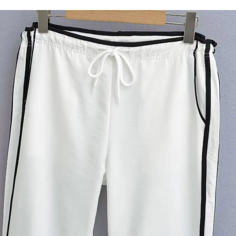 Women's straight leg trousers with ribbon waist and parallel bars contrast detailing in navy blue