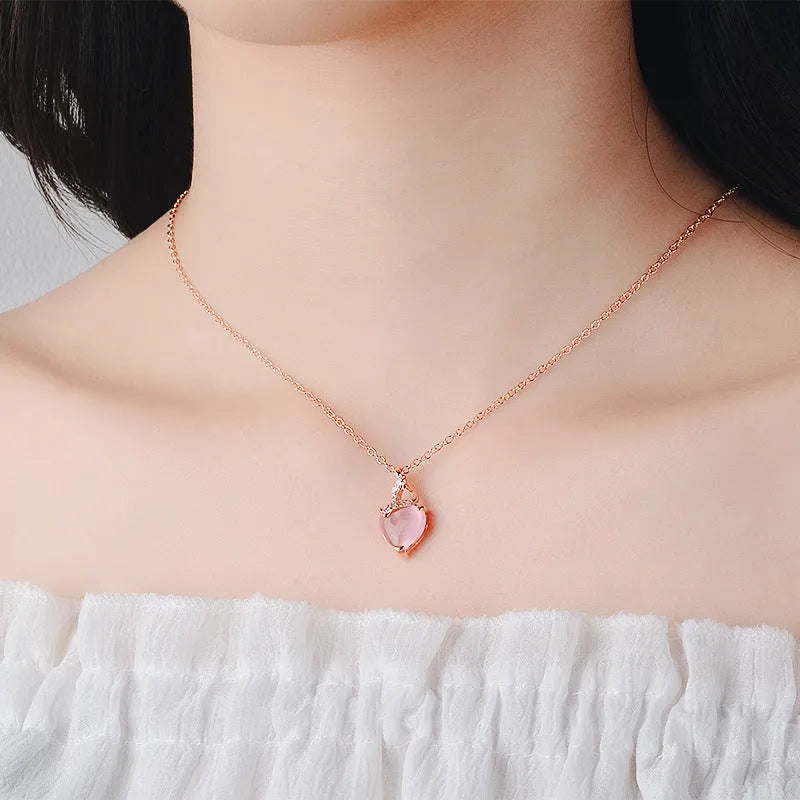 Rose gold electroplated heart-shaped crystal pendant necklace with cross chain design
