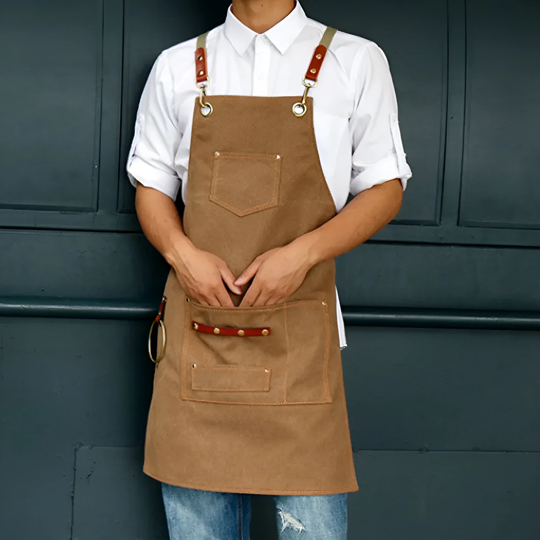 Canvas apron with cross back straps in camel colour for cafe and baking workwear