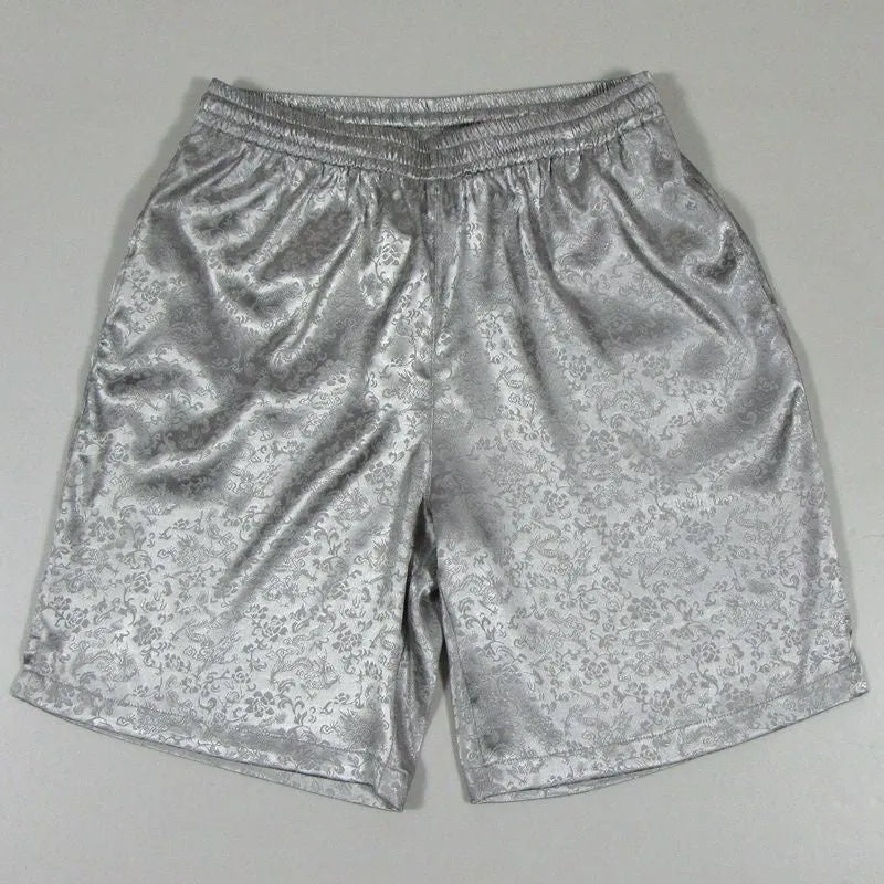 Men's black Tang suit style shorts with a loose fit and elasticated drawstring waistband.
